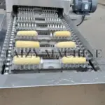 a machine with corn on it