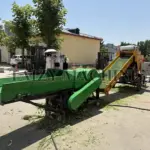 The bale wrapper and chaff cutter are connected in tandem; the chaff cutter processes large chunks of dry hay, straw, and similar materials into finely chopped fragments, which are then conveyed directly onto the bale wrapper's conveyor belt.